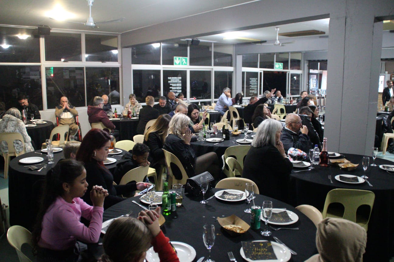 Guests seated for a birthday dinner