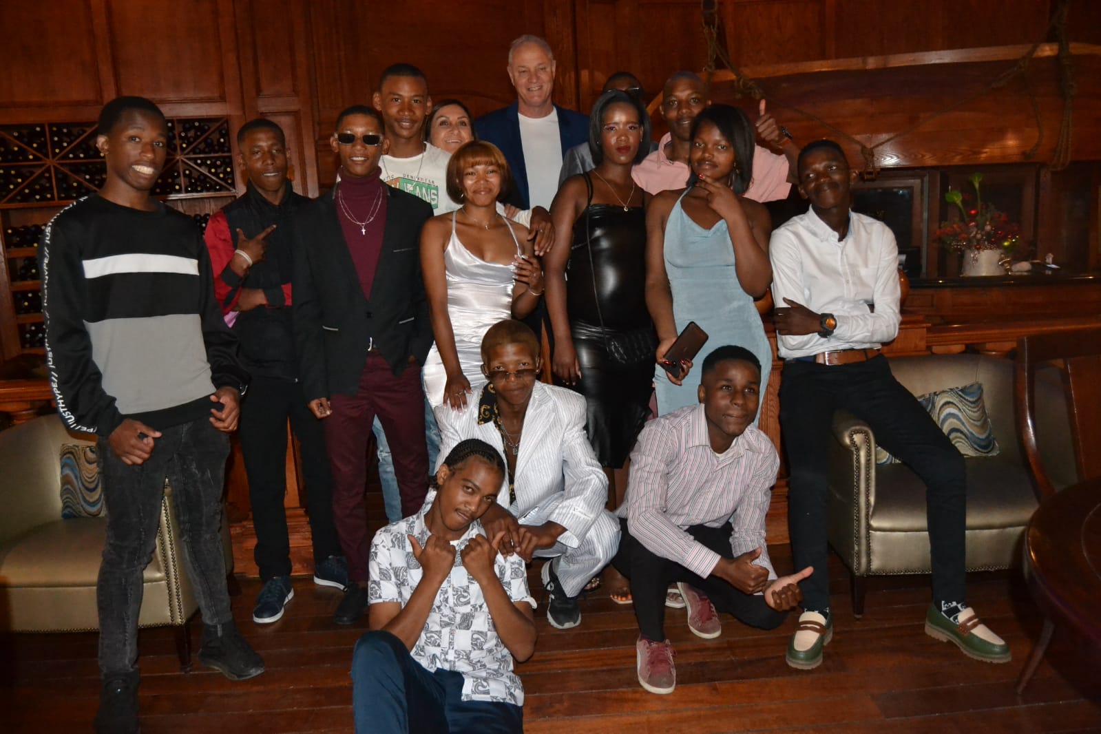 Group portrait on the steps of a restaurant