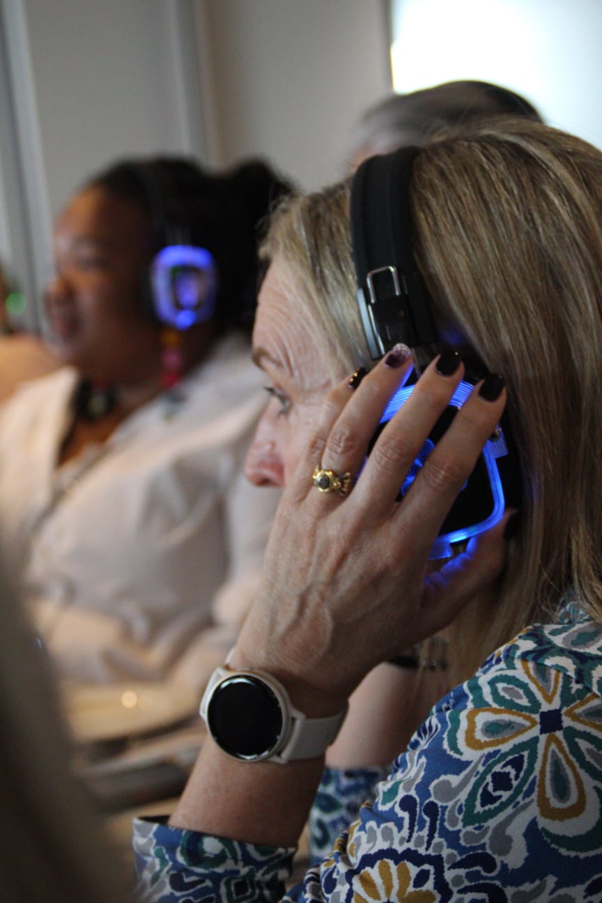 Guest adjusting glowing headphones