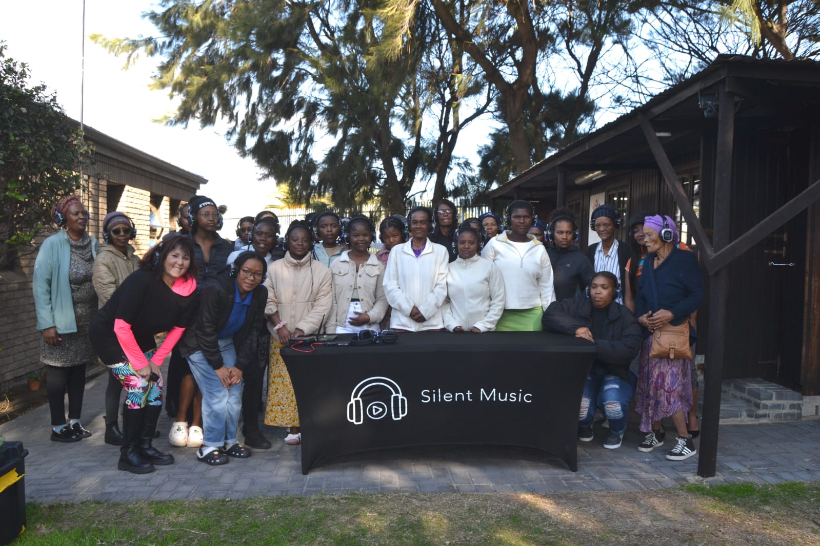 Group wearing headphones at a silent music event