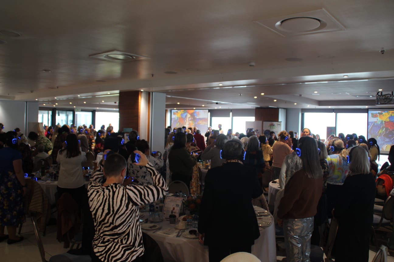 Crowded function room during a silent disco