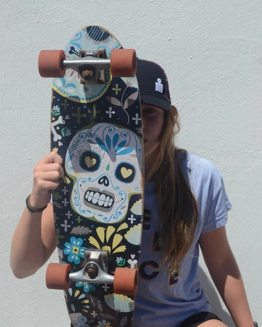 Skateboard held up in front of the rider