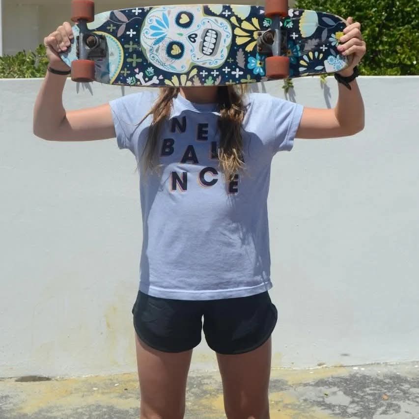 Skateboard held overhead